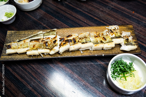 Delicious and healthy grilled eel cooked on an iron plate until yellow.