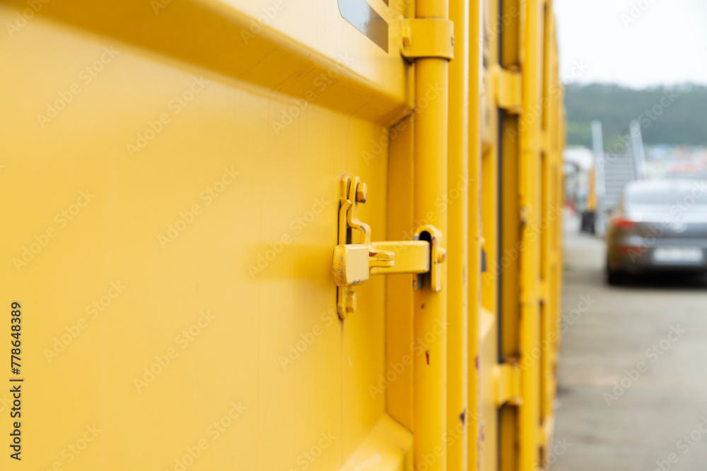 View of the yellow cargo container at the harbor
