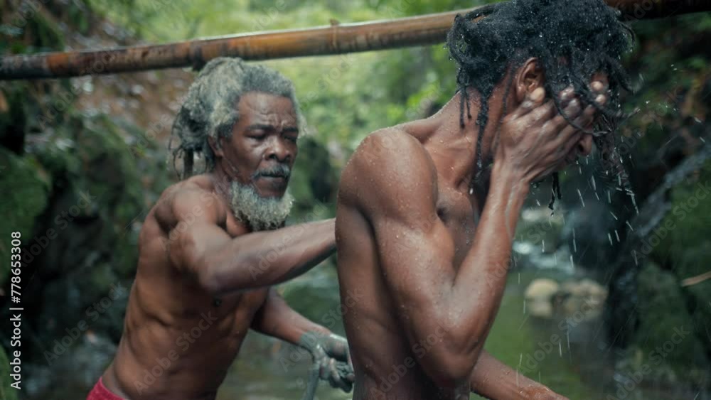Rasta Men Washing Ceremony with mud