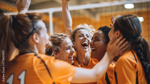 Women of various backgrounds on a volleyball team, celebrating a point, emphasizing unity and diversity.