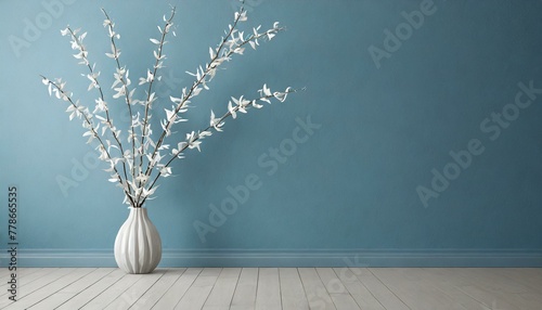 Minimalist Elegance: Blue Empty Wall with White Dry Branches as Decor