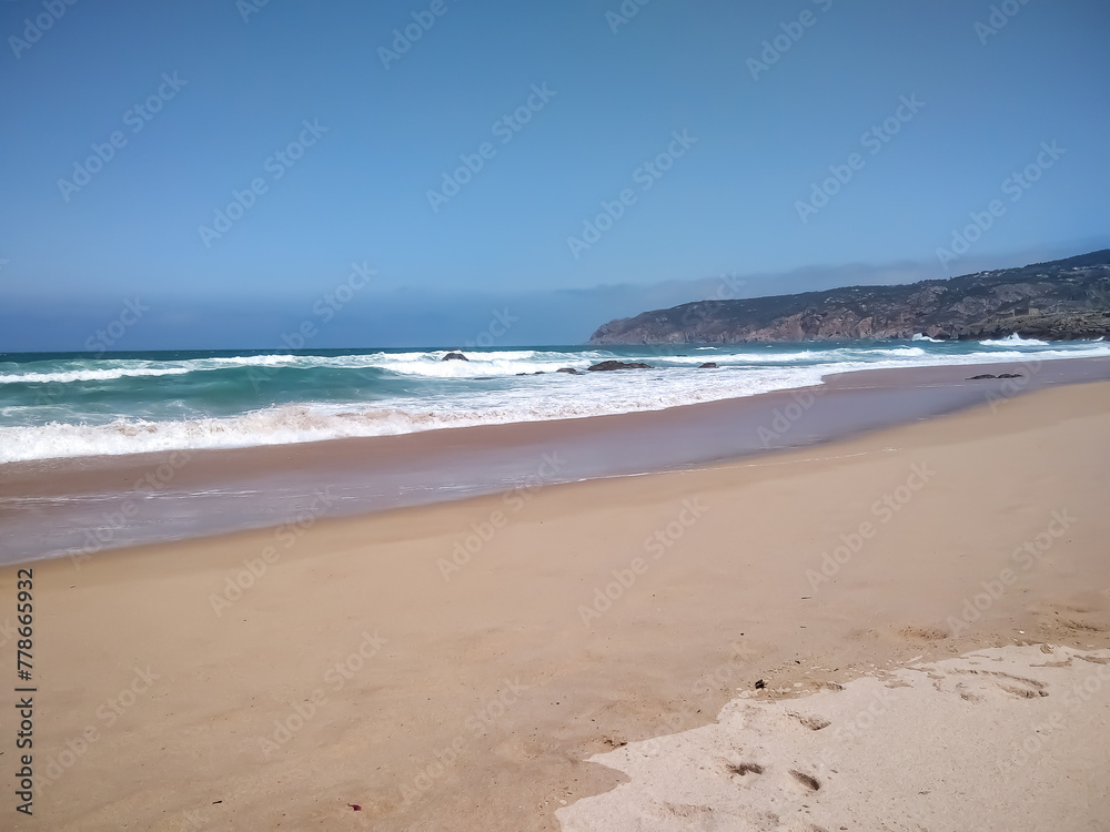 Coast of Portugal. One of the beaches in Cascais with crystal clear water. A great place for water sports - surfing. Coast of Portugal. One of the beaches in Cascais with crystal clear water. A great place for water sports - surfing.