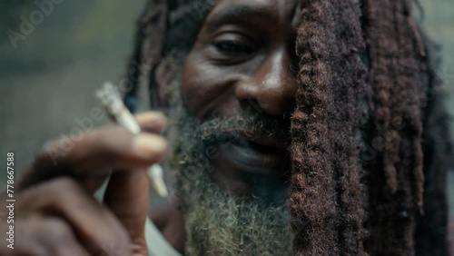 Extreme closeup of Rasta Man while Smoking Marijuana photo