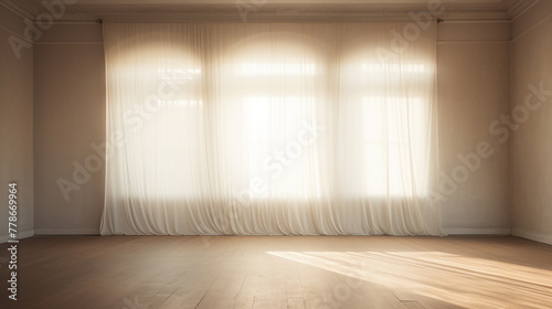 backlit window with white curtains and wooden floor in empty room