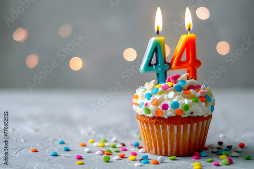 Birthday cupcake with number forty-four candle