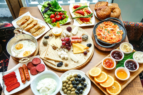 Wooden Table Set With Plates of Food