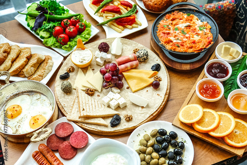 Wooden Table Set With Plates of Food