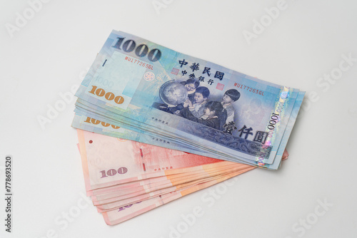 Taiwanese dollar banknote on white background