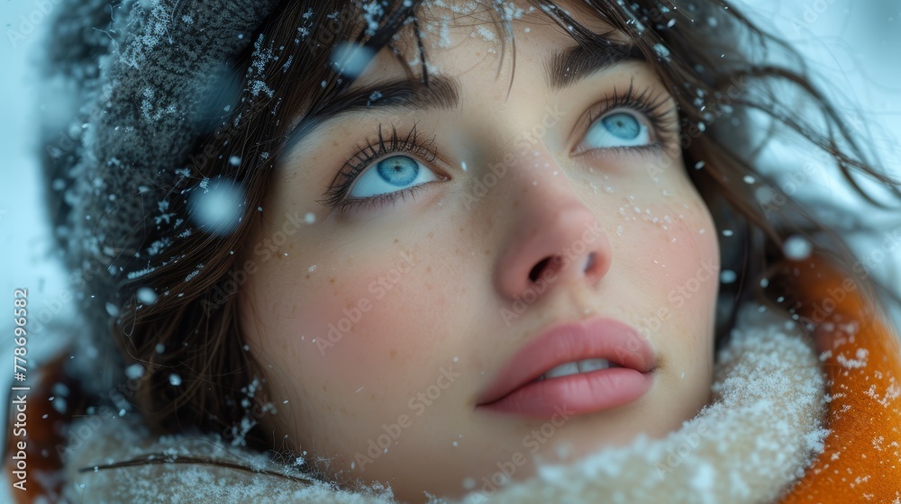 a close up of a woman wearing a scarf and a hat with snow falling on her and her eyes wide open. a close up of a woman wearing a scarf and a hat with snow falling on her and her eyes wide open.