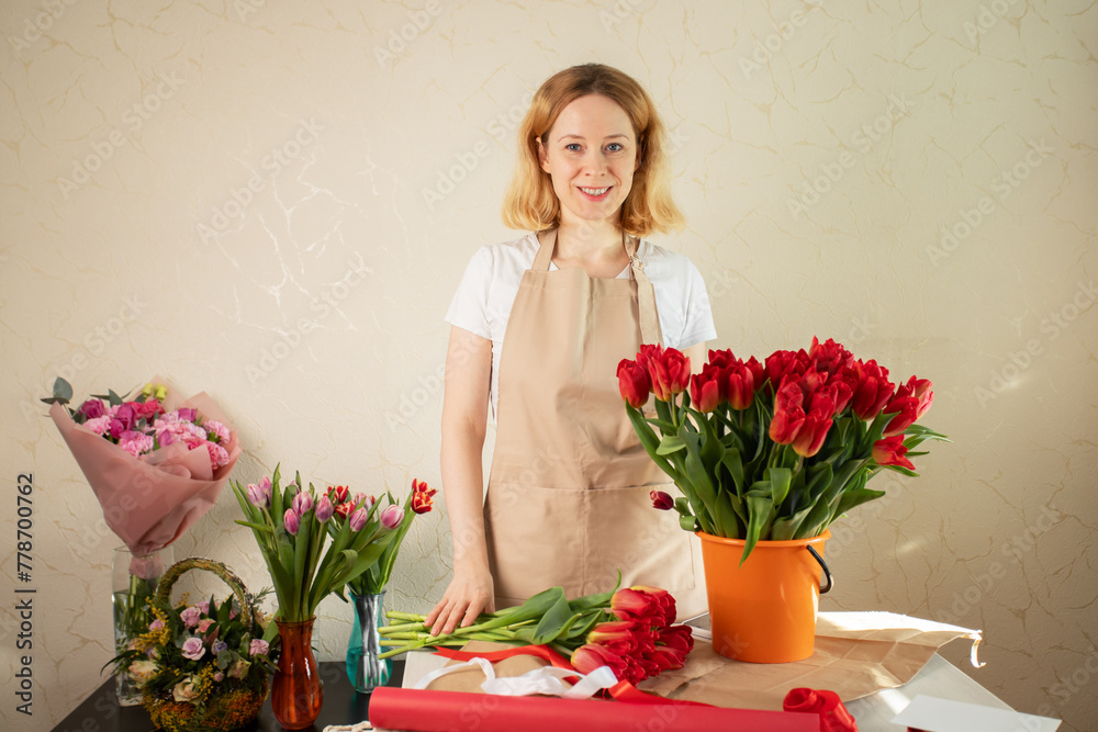 Professional florist in a flower shop, floral arrangement service, retail business. Professional florist in a flower shop, floral arrangement service, retail business.