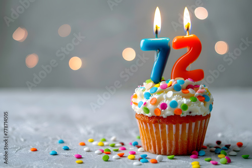 Birthday cupcake with number seventy-two candle