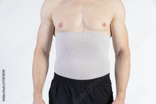 Male model orhopedic medical strap for torso white background photo