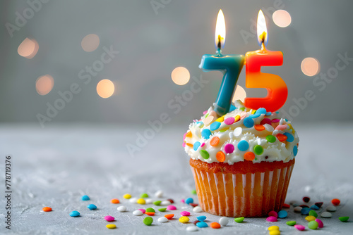 Birthday cupcake with number seventy-five candle