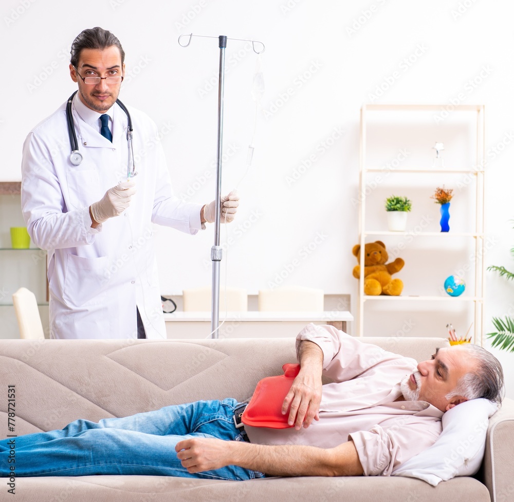 Young male doctor visiting old patient at home Young male doctor visiting old patient at home
