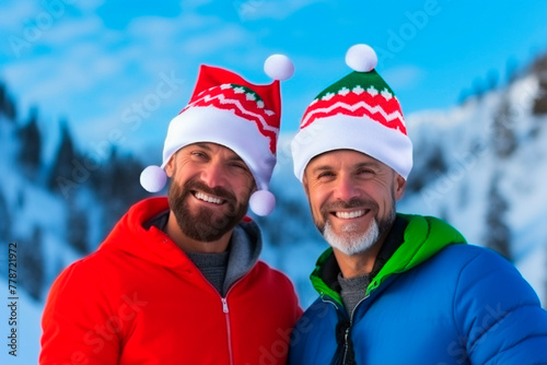 Two guys in Santa hats hug each other. LGBT concept.