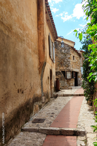 Narrow street in medieval Eze village in French Riviera  France