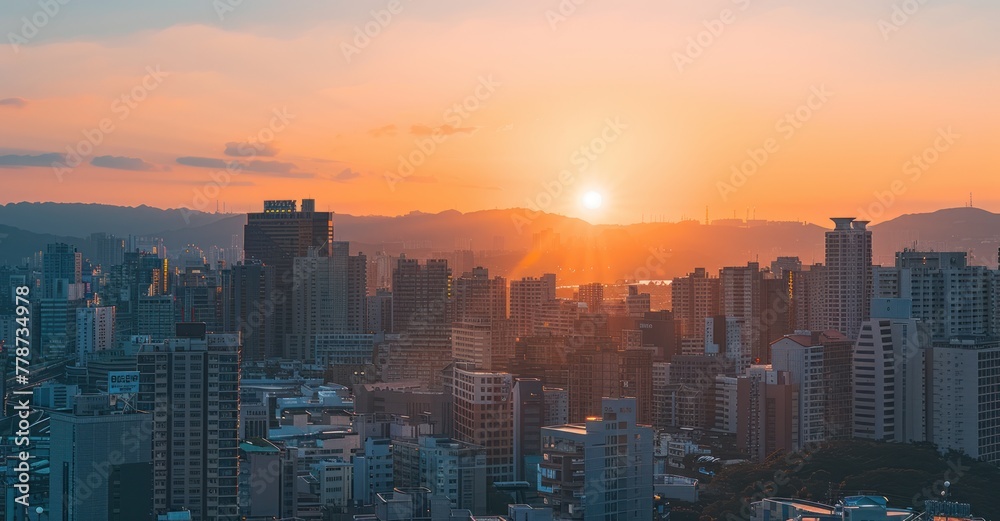 Dawning Metropolis: Sunrise Illuminates Urban Skyline in Warm Hues