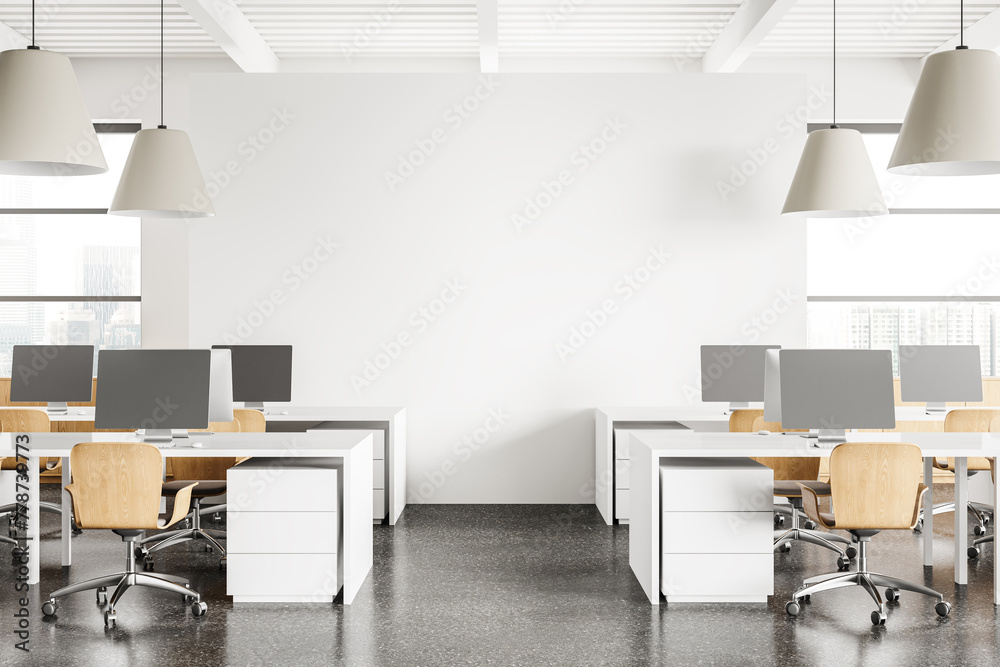 Fototapeta premium Modern coworking interior with pc desktop on tables and window. Mockup wall