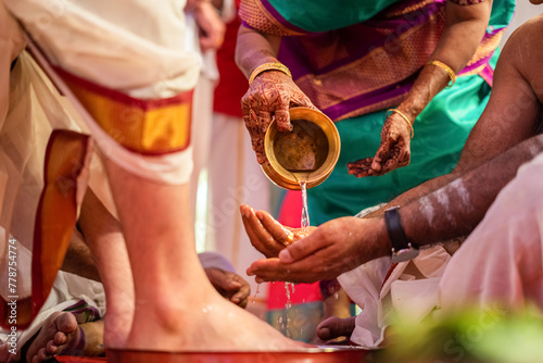 Traditional Hindu South Indian wedding rituals of bride and groom with wedding background. a girl and boy gets converted to husband and wife. kanyadana