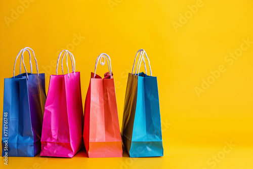 Colorful shopping bags for sale, perfect for gift-giving and festive occasions, displayed in a store window photo