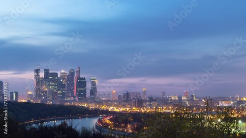 Panoramic view of Moscow City, Russia, from Sparrow Hills day to night transition timelapse from above. Cloudy colorful sky over skyscrapers