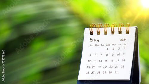 May 2024 - A small desktop calendar May 2024 with nature background, time and business concept.
