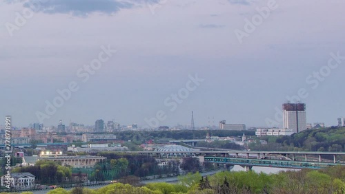 Panoramic view of Moscow City, Russia, from Sparrow Hills after sunset day to night transition timelapse. Luzhniki stadium and bridge over river photo