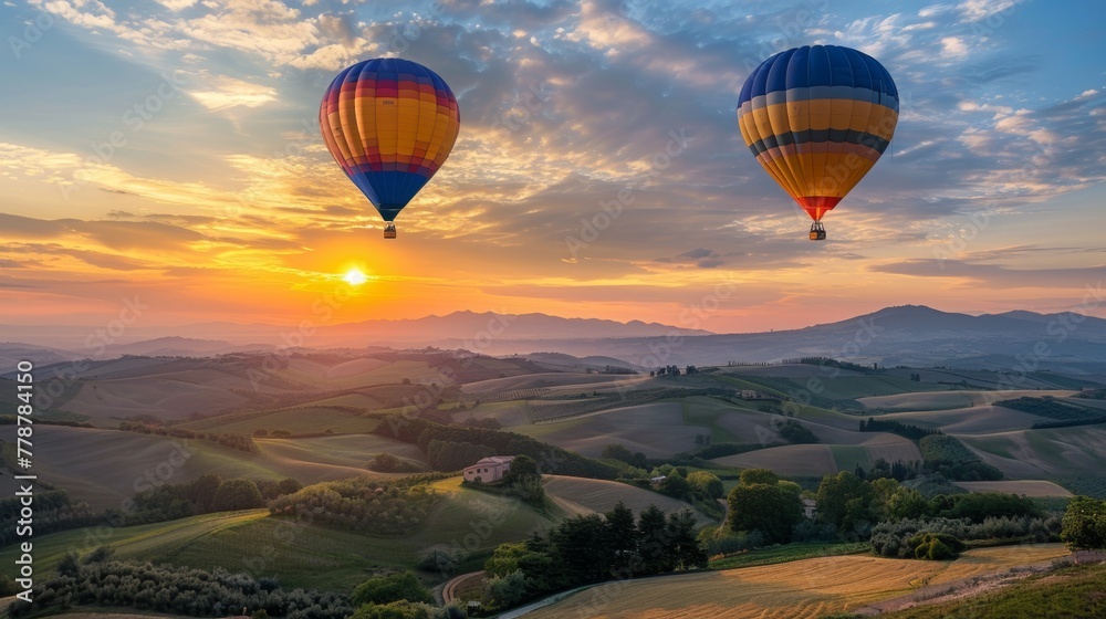 A hot air balloon ascending at sunrise over rolling hills