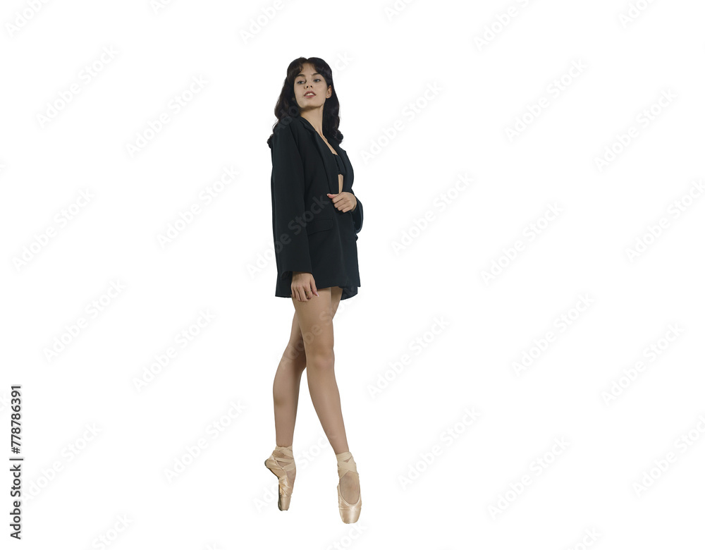 young ballerina dressed in a jacket stands on pointe shoes against the wall, looking in the mirror young ballerina dressed in a jacket stands on pointe shoes against the wall, looking in the mirror