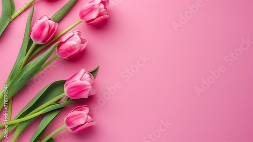 Mother's Day background with copy space, pink tulips on pink background, ideal for posters, brochures, and promotional materials, aura and dreamy top view © praewpailyn