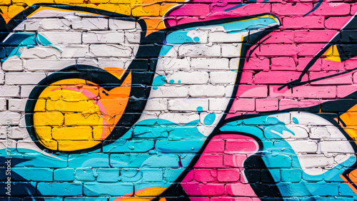 Vibrant and colorful graffiti on a brick wall representing street art and urban culture, perfect for modern creative backgrounds.