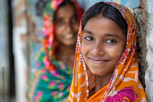 Close-up portrait of a smiling Bangladeshi girl in a colorful hijab