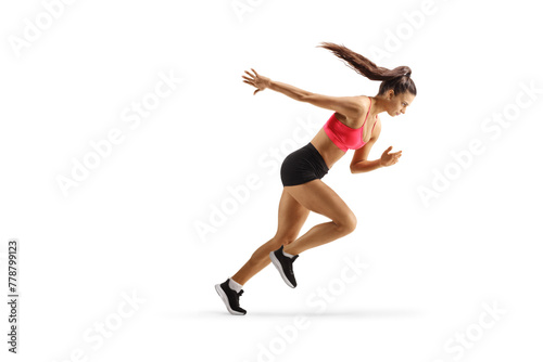 Full length profile shot of a female athlete running