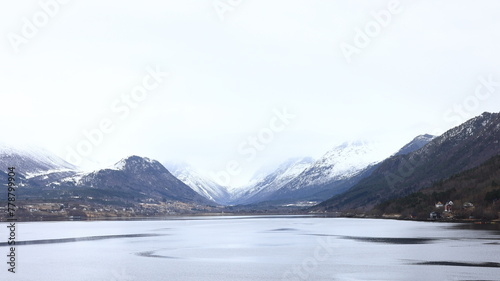 The view from the Andalsnes waterfront looking towards Isfjorden, Norway. Isfjorden is a small village in the Rauma Valley on the shores of Romsdalsfjord.