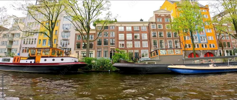 POV: on a boat in Amsterdam, Netherlands, in spring