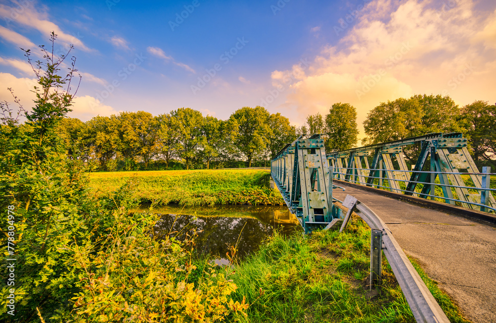 Fototapeta premium Laarbrug bridge crossing the Wilhelminakanaal canal. Village of Aarle-Rixtel, The Netherlands.