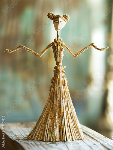 Handicraft small figure of a fantasy woman made of seeds and wood. Natural materials. photo