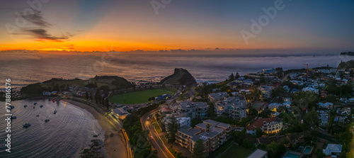 Foggy sunrise at the seaside photo