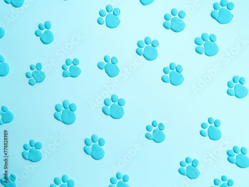 Blue paw prints on a background, minimalist backdrop pattern with copy space for design or photo, animal pet cute surface