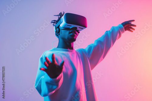 Enthralled in the metaverse, a male user in VR goggles interacts with a virtual world, his silhouette cast against a backdrop of vivid pink and blue neon background. #778837325