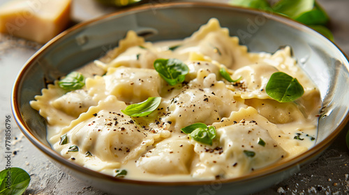 Cooked ravioli on a plate with a light drizzle of oil and fresh herbs. Warm lighting highlights the pasta's texture and garnish. 