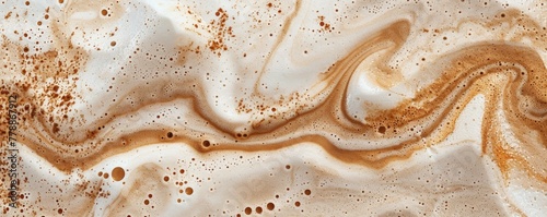 Abstract background of creamy coffee swirls with bubbles and froth