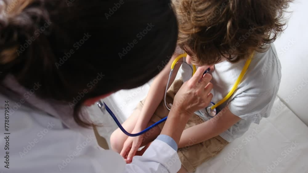 A pediatrician and nurse examine a toddler at the hospital, using a stethoscope to diagnose lung issues, fostering trust and togetherness in healthcare. A pediatrician and nurse examine a toddler at the hospital, using a stethoscope to diagnose lung issues, fostering trust and togetherness in healthcare.