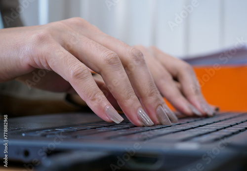 An employee is typing a document