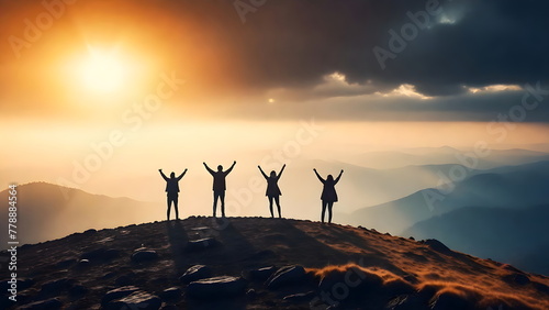 Success concept, four Silhouette of a people with arms raised up in the mountains at sunset