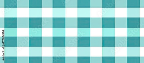 The sky blue and emerald green tartan pattern on a white background creates a timeless and classic look. The intersecting rectangles form a stylish and versatile textile design