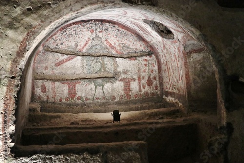 Napoli - Pavone affrescato su un arcosolio delle Catacombe di San Gennaro photo