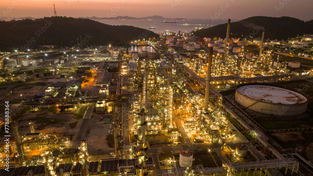 Fototapeta premium Oil Refinery Gas Chemical Equipment Prodiction import export Concept, Crude Oil Refinery Plant Steel Pump Pipe line and Chimney and Cooling tower, Chemical or Petrochemical Factory plant, industry