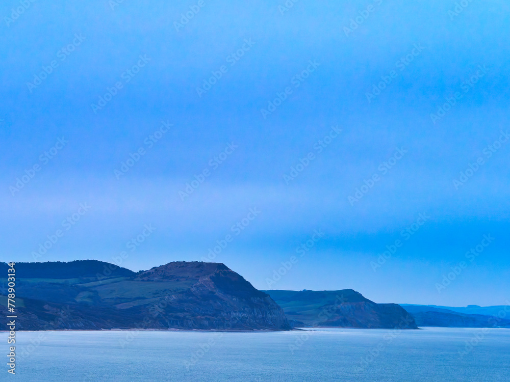The jurassic coastline with Lyme Bay captured on January mornings from Lyme Regis in Dorset The jurassic coastline with Lyme Bay captured on January mornings from Lyme Regis in Dorset