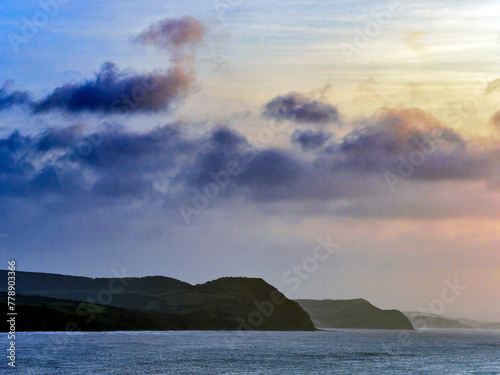 The jurassic coastline with Lyme Bay captured on January mornings from Lyme Regis in Dorset photo